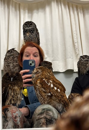 Jen covered in 5 owls